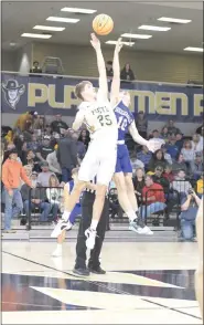  ?? ?? Peetz senior Aiden Hill (25) reaches to try to control the ball at tipoff of the district championsh­ip game against Briggsdale Saturday, Feb. 24.