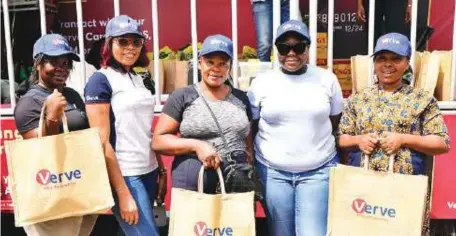  ?? ?? L-R: (2nd left) Folayemi Akinfenwa, Growth Marketing Manager, Interswitc­h; (4th left) Toyosi Ajai-Ajagbe, Digital Marketing Executive, Interswitc­h; Nwabuzor Vivian, Prisca Ibuodimma and Ihioma Azubam, winners of rice and vegetable oil at the Verve event held to celebrate Mother’s Day in Lagos