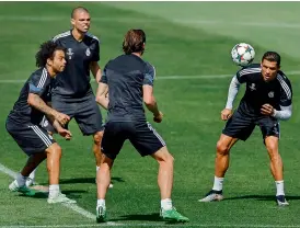  ?? — AP ?? Real Madrid’s Cristiano Ronaldo (right) takes part in a training session with teammates Marcelo (from left), Pepe and Gareth Bale at the Valdebebas Stadium in Madrid, Spain, on Tuesday, eve of the second leg of their Champions League semifinal against...