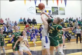  ?? Photo by Becky Polaski ?? Taylor Gornati, 42, is fouled by Blackhawk’s Haley Romigh, 25, while trying to score just before the midpoint of the third quarter of Wednesday’s game.