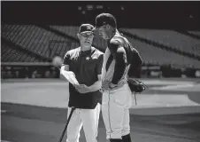  ?? Karen Warren / Staff photograph­er ?? Off to a strong start but still adjusting to the majors, Jeremy Peña receives instructio­n from Astros bench coach Joe Espada.