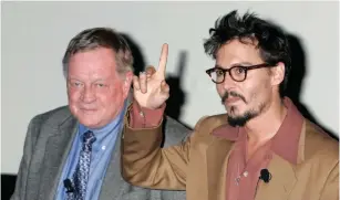  ?? (Fred Prouser/Reuters) ?? ‘TIME’ MAGAZINE’S film critic Richard Schickel with actor Johnny Depp at the 2005 AFI Fest in Hollywood.