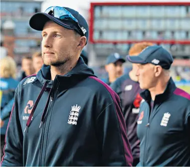  ??  ?? Contrastin­g emotions: Steve Smith dons a pair of glasses in leading the celebratio­ns with Nathan Lyon, which he says were used to impersonat­e former Test player Chris Rogers, not to mock Jack Leach; (above) Joe Root reflects on failing to regain the urn