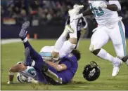  ?? NICK WASS - THE ASSOCIATED PRESS ?? FILE - In this Oct. 26, 2017, file photo, Miami Dolphins middle linebacker Kiko Alonso, top left, collides with Baltimore Ravens quarterbac­k Joe Flacco as Flacco slides on the field after rushing the ball in the first half of an NFL football game in Baltimore.