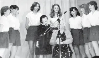  ??  ?? Deirdre Gowen & Co sings ‘Grandma We Love You’ to Mrs Mary Ellen O’Mahony as part of Tops Of The Parish circa 1980.