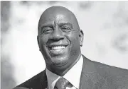  ?? [AP PHOTO] ?? Hall of Fame point guard Magic Johnson was put in charge of basketball operations for the Los Angeles Lakers on Tuesday. Team owner Jeanie Buss fired general manager Mitch Kupchak as the tradition-rich franchise continues to struggle.