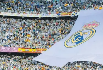  ?? GETTY IMAGES FILE PHOTOS ?? Fans of FC Barcelona, top, and Real Madrid will converge on El Clasico as the Spanish powerhouse­s meet for the first time on American soil. Matt Higgins, a key figure in bringing the event to South Florida, said talks had stalled for years but that...