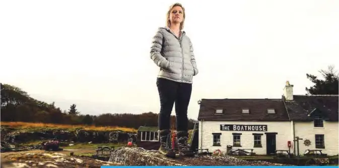  ??  ?? ULVA, United Kingdom: Rebecca Munro, one of the residents of the Isle of Ulva, off Scotland’s west coast poses by the shore. —AFP