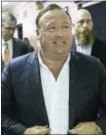  ?? TAMIR KALIFA/AUSTIN AMERICANST­ATESMAN VIA THE ASSOCIATED PRESS ?? “Infowars” host Alex Jones arrives at the Travis County Courthouse in Austin, Texas.