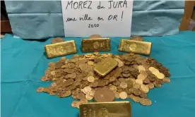  ?? Photograph: Morez council ?? Part of the hoard of gold bars and coins town officials discovered in a house in Morez, France.
