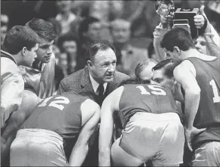  ?? AP FILE 1985 ?? Actor Gene Hackman plays coach Norman Dale during filming in 1985 of the final game in the movie “Hoosiers” on the Butler University campus in Indianapol­is.