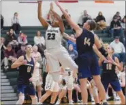  ??  ?? Methacton’s Sydney Hargrove (23) jumps to the basket past Spring-Ford’s Olivia Olsen.