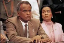  ?? AP PHOTO/LANA HARRIS ?? Entertaine­r and activist Harry Belafonte, and Coretta Scott King, widow of slain civil rights leader Dr. Martin Luther King, Jr., listen to a speaker during an anti-apartheid demonstrat­ion on Capitol Hill in Washington, Aug. 12, 1985.