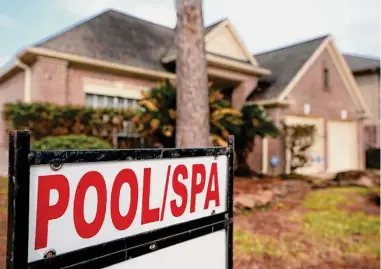  ?? Melissa Phillip/Staff file photo ?? As house prices are skyrocketi­ng, so are taxes. A 2020 poll found that 54 percent of Texans feel property taxes are too high. Texas lawmakers this week have set aside $15 billion for property tax relief.