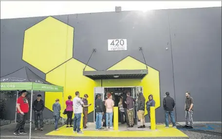  ?? Photograph­s by Marcus Yam Los Angeles Times ?? WITHIN two hours of opening Monday morning, more than 100 customers had made purchases at 420 Central in Santa Ana.