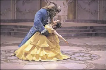  ??  ?? Emma Watson stars as Belle and Dan Stevens as the Beast in Disney’s “Beauty and the Beast.”