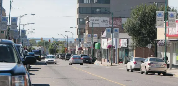  ?? GORD WALDNER/ The Starphoeni­x photos ?? Traffic is seen in downtown North Battleford. The town has a population of about 14,000; nearly 4,000 live in the neighbouri­ng town of Battleford.