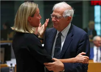  ??  ?? European Union foreign policy chief Federica Mogherini (left) talks to Spain’s Foreign Minister Josep Borrell during a European Foreign Affairs meeting at the European Council headquarte­rs in Brussels, on Monday. AP PhoTo/FrAncIsco seco