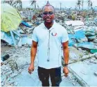  ??  ?? apl.de.ap of Black Eyed Peas visits a barrio left devastated by Yolanda with food and donations