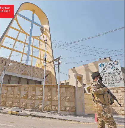  ?? Photo: Nampa/AFP ?? Alert… A member of the Iraqi forces stands outside the Syriac Catholic Church of Our Lady of Deliveranc­e in the Karrada district of Iraq’s capital Baghdad on 1 March 2021 amidst preparatio­ns ahead of the pontiff ’s visit.