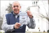  ?? Ned Gerard / Hearst Connecticu­t Media file photo ?? Former Southbury First Selectman Ed Edelson poses with a copy of his book, “Lois’s Story: A Young Girl’s Inspiratio­n Helps to Stop Hate and Fear,” in front of South Britain Congregati­onal Church, in Southbury on Dec. 30. 2020.