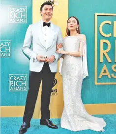  ??  ?? ‘Crazy Rich Asians’ actors Henry Golding and Constance Wu during the premiere of the movie in Los Angeles. — Reuters photo