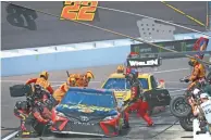  ?? PHOTOS BY PATRICK BREEN/THE REPUBLIC ?? Right: Martin Truex Jr. (78) and Joey Logano (22) come in for a pit stop at ISM Raceway during the TicketGuar­dian 500.