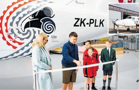  ?? ?? Cutting the ribbon at the relaunch of the upgraded air ambulance are (from left) Napier mayor Kirsten Wise, former patient Thomas Watson, Te Mata School students Cartier Brookfield and Brody Manuel and Oscar Brookfield from Hereworth School.