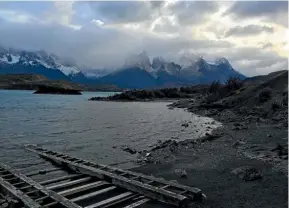  ??  ?? The imposing Cuernos del Paine looms over Patagonia’s Lake Pehoe.