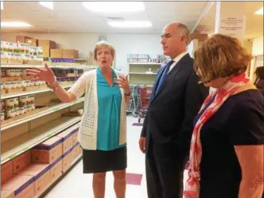  ?? EVAN BRANDT — DIGITAL FIRST MEDIA ?? Barbara Wilhelmy, left, executive director of the Cluster Outreach Food Pantry in Pottstown, gives U.S. Sen. Bob Casey a tour of the facility before he departed for Washington, D.C., to vote on the Senate’s farm bill.