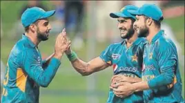  ?? AFP ?? ■ Shadab Khan (left) and Hasan Ali (centre) celebrate the wicket of an Australia batsman in Wednesday’s T20.