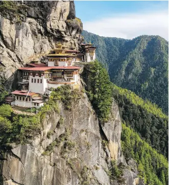  ??  ?? Bhutan’s most famous monastery, the sacred and iconic Tiger’s Nest Monastery, is perched on a steep cliff more than 820 metres above the town of Paro. The holy place was built in 1692 and is a must-see for many tourists.