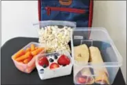  ?? PHOTOS BY MICHILEA PATTERSON — DIGITAL FIRST MEDIA ?? A healthful packed school lunch should include calciumric­h item, a whole grain and a vegetable or a fruit.