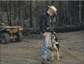  ??  ?? DALEY and his dog, Newt, continue their search for lost cattle. “I am absolutely tired of politician­s and politics, from both the left and the right,” he said in a post.