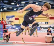  ?? ROBERTO E. ROSALES/JOURNAL ?? Hunter Woodhall competes in the 400-meter dash Friday at the USATF Indoor Championsh­ips.