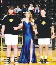  ?? ?? Junior maid Reany White, daughter of Casey and Jackie White, escorted by Ryder Orr (left), son of Bart and Tara Orr, and Cole Ashley, son of Jeremy and Tracie Ashley.