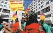  ?? Luis Sinco Los Angeles Times ?? NURSES JOIN UC workers staging a walkout in May at the Ronald Reagan UCLA Medical Center.