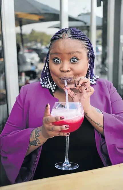  ?? Picture: Alaister Russell ?? Lesego Tlhabi sips a juice at Tashas, just like her alter ego Coconut Kelz would. Tlhabi admits she once considered voting DA.