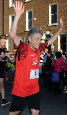  ??  ?? Turkish ambassador Burhan in action during the 5k and right, in happy mood after accepting his medal for taking part.