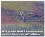  ??  ?? HELL & HIGH WATER Rain races down Mourne’s ‘black staircase’ yesterday