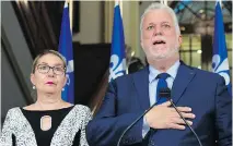  ?? JACQUES BOISSINOT/THE CANADIAN PRESS ?? “I ask my party to stay faithful to its values and above all not trade them off for a few votes,” said Philippe Couillard, shown Thursday with wife Suzanne Pilote.