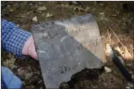  ?? AP PHOTO/MICHAEL CASEY ?? In this photo taken Friday, Sept. 29, 2017 in Greenland, N.H., John Brackett holds the headstone of Phillis Jack, whose family offered shelter to Ona Judge, a slave who was owned by George Washington’s family and escaped to New Hampshire in 1796. The...