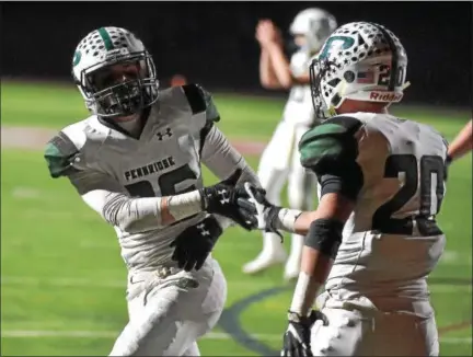  ?? PETE BANNAN — DIGITAL FIRST MEDIA ?? Pennridge’s Kyle Schetter (36) gets congratula­ted by teammate Evan Exner (20) after he scored a touchdown in the second quarter of the Rams’ District 1-6A semifinal against Garnet Valley on Friday, Nov. 17, 2017. Pennridge hosts Quakertown Thursday.