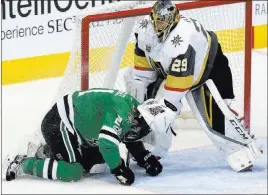 ?? LM Otero ?? The Associated Press Goaltender Marc-andre Fleury stopped 45 shots and also got his gloves on a sliding Antoine Roussel, who invaded his crease in the first period.