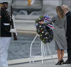  ?? EVAN VUCCI — ASSOCIATED PRESS ?? President Donald Trump and first lady Melania Trump participat­e in a wreath laying ceremony at the World War II Memorial to commemorat­e the 75th anniversar­y of Victory in Europe Day, May 8, in Washington.