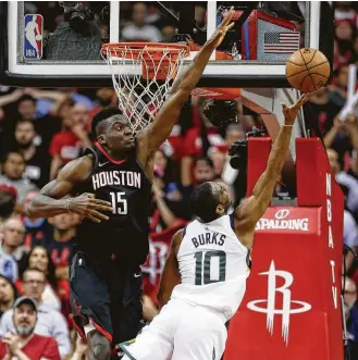  ?? Brett Coomer / Houston Chronicle ?? Jazz guard Alec Burks, right, must contend with the long arm of the Rockets’ defensive law in the form of Clint Capela, who blocked five shots in the final three minutes of Tuesday’s Game 5 win.