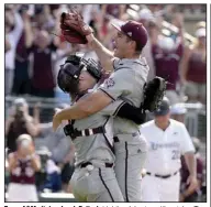  ?? (AP/Sam Craft) ?? Texas A&M pitcher Jacob Palisch (right) celebrates with catcher Troy Claunch after finishing the Aggies’ 4-3 victory over Louisville on Saturday afternoon in Game 2 of a NCAA Super Regional game at College Station, Texas. The Aggies advanced to the College World Series with the win.