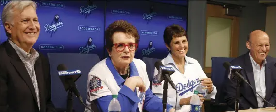  ?? AP PHOTO/ALEX GALLARDO ?? Los Angeles Dodgers owner and chairman Mark Walter (left) and Dodgers president &amp; CEO Stan Kasten (right) introduce to the baseball team ownership group, tennis champion Billie Jean King (second from left) and her partner Ilana Kloss at a news conference in Los Angeles, on Friday.