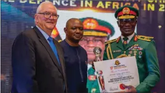  ?? ?? L-R: Prof Henri Fouche; CEO SWAI, Mr Patrick Agbambu and Major General Victor Okwudili Ezegwu, who received the award for courage, commitment, and patriotism