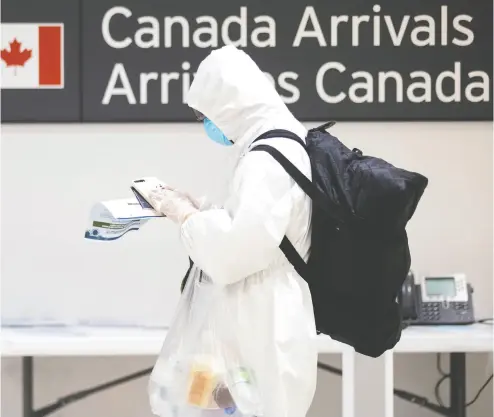  ?? CHRIS YOUNG / THE CANADIAN PRESS FILES ?? Between April 1 and 14, 90 domestic flights carried passengers who were found to have COVID, with 50 of those flights originatin­g in Vancouver, John Ivison writes. Six flights from Vancouver are to land in Toronto on Wednesday.